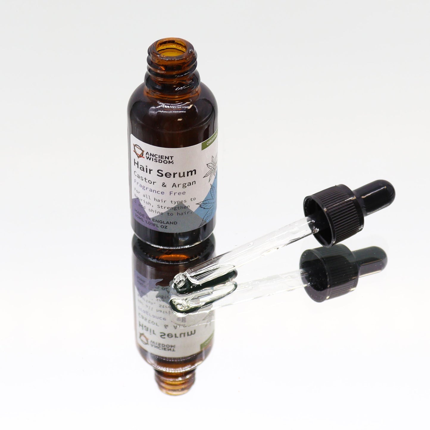 Haarserum Duftfrei – Glasflasche auf Spiegel, Tropfer daneben