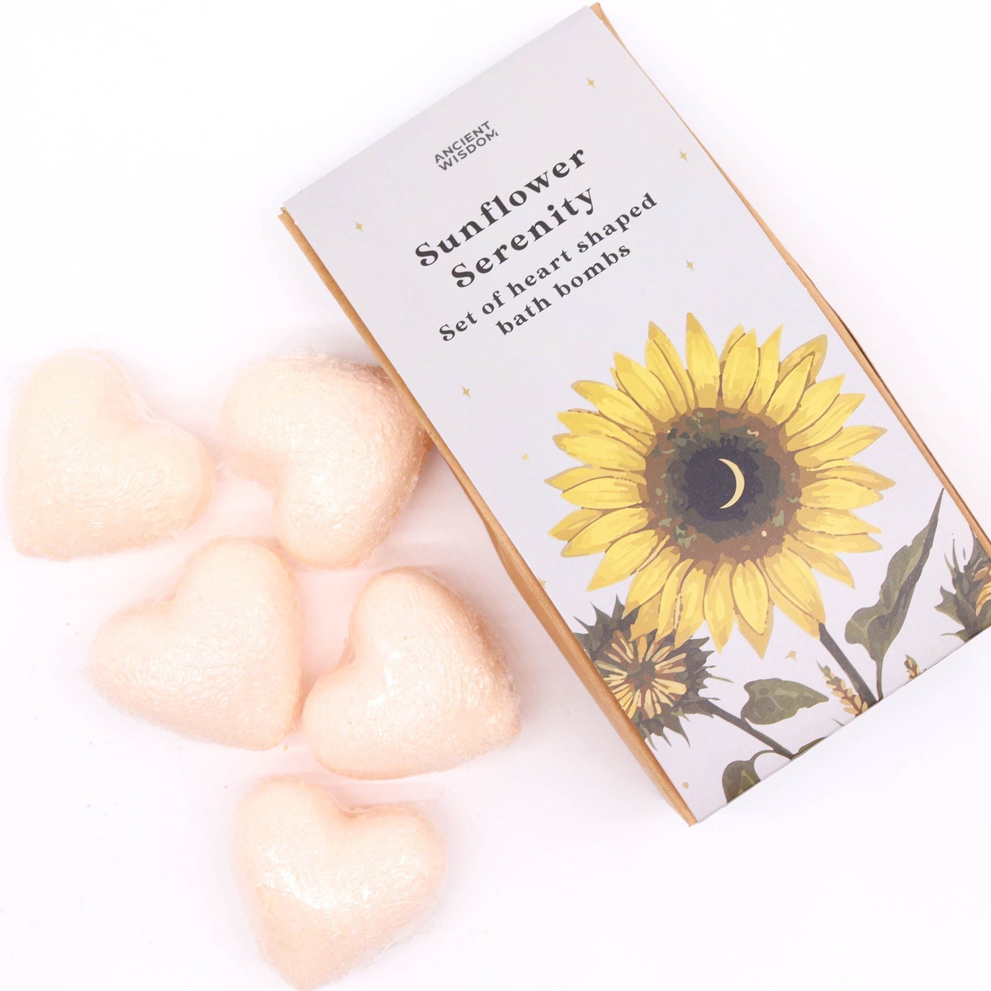 Badeherz-Geschenkset Sunflower Serenity – cremefarben Badeherzen neben Verpackung