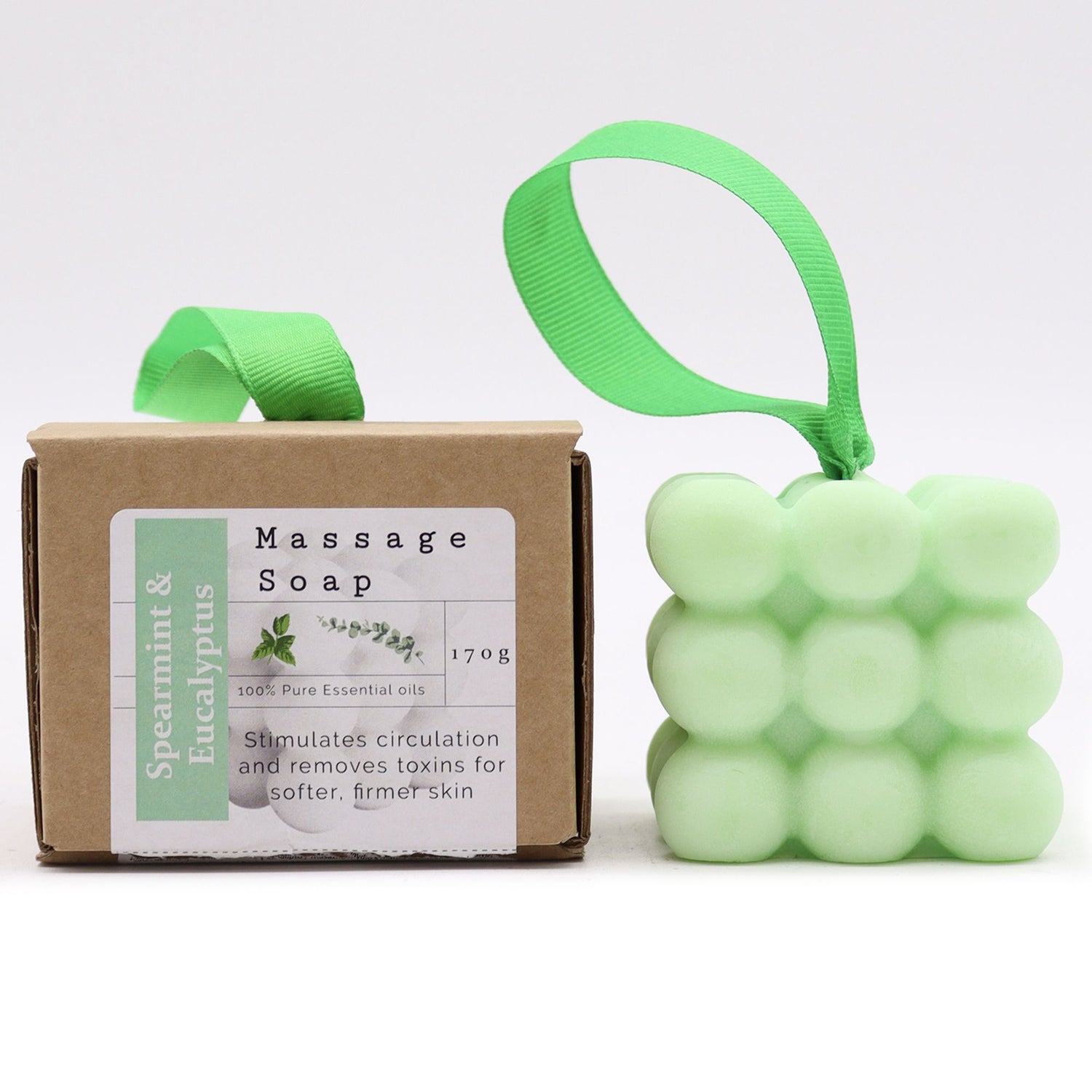 Massageseife Pfefferminze und Eukalyptus – Verpackung und Seife nebeneinander, Frontansicht, Freisteller