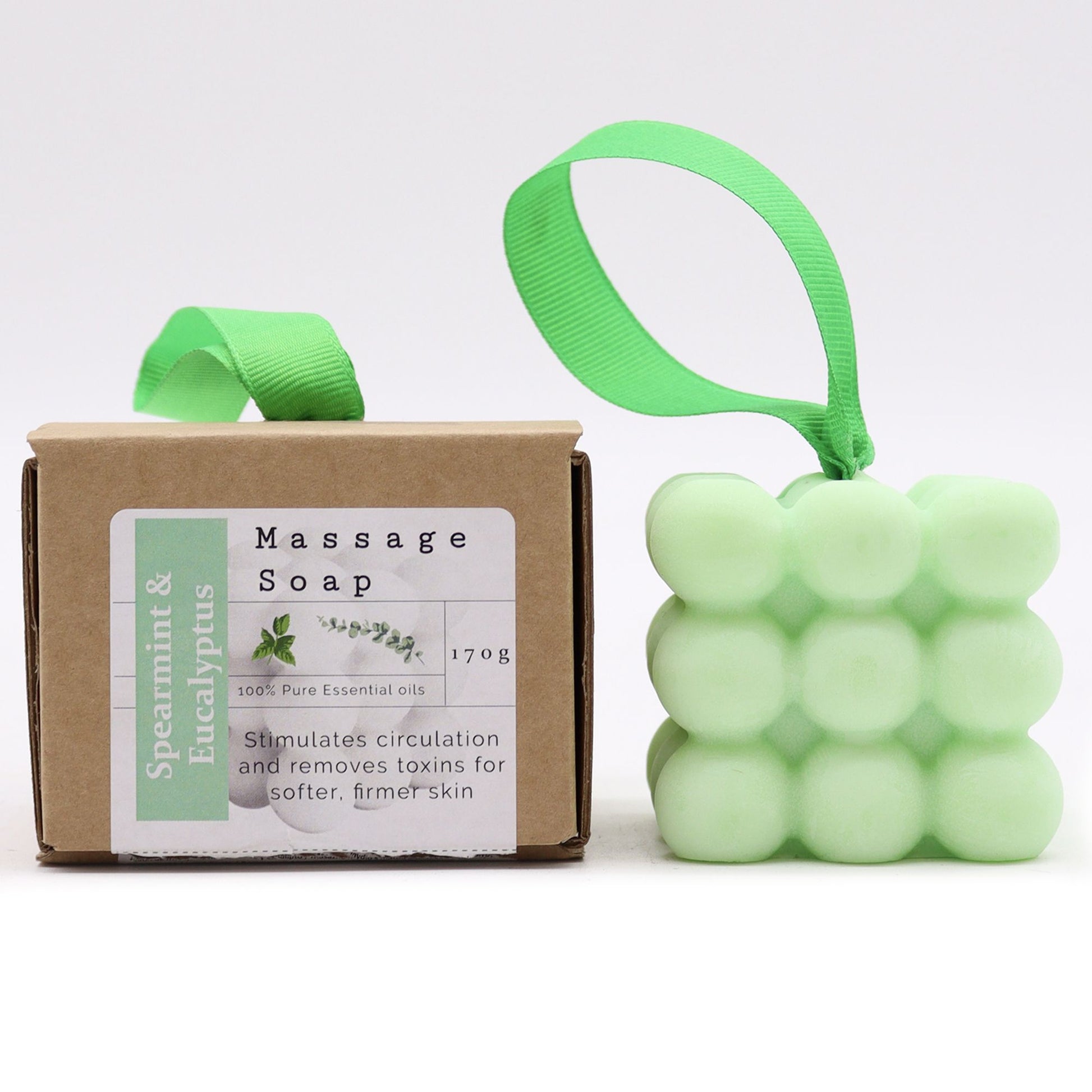 Massageseife Pfefferminze und Eukalyptus – Verpackung und Seife nebeneinander, Frontansicht, Freisteller